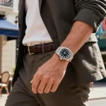 Stylish individual showcasing a Rolex super clone watch in urban setting, highlighting luxury and craftsmanship.